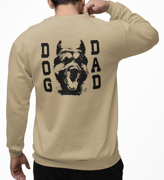 Man wearing a sand sweatshirt with 'DOG DAD' graphic on the back