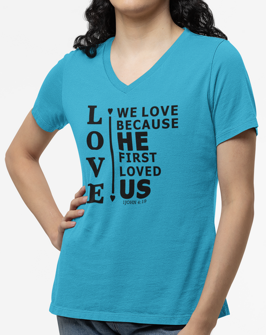 Turquoise women's v-neck t-shirt with black text from scripture verse 1 John 4:19