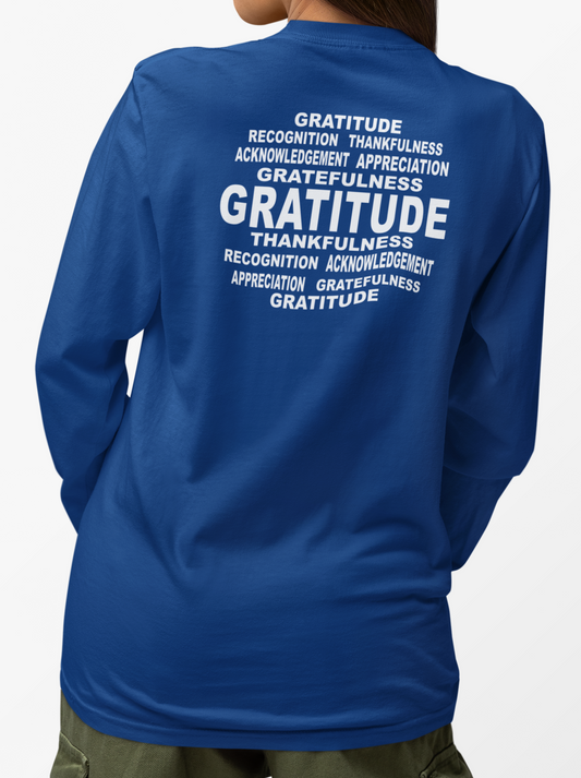 Woman wearing a royal blue long-sleeve shirt with 'Gratitude' text on the back, on a white background