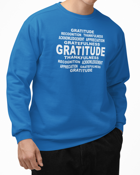 Man wearing a sapphire blue sweatshirt with 'Gratitude' text on a white background