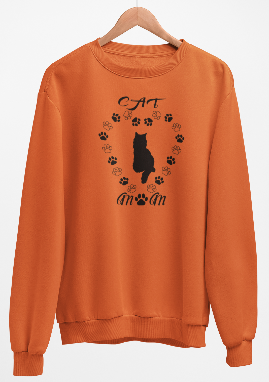 Orange sweatshirt with a black cat design on a hanger against a white background