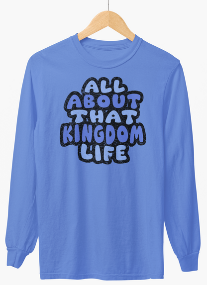 Carolina blue long-sleeve shirt with 'All About That Kingdom Life' distressed text on a hanger against a white background