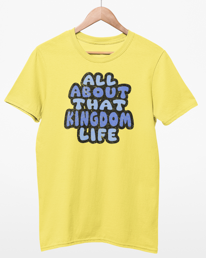 Cornsilk t-shirt with distressed text 'All About That Kingdom Life' on a hanger against a white background