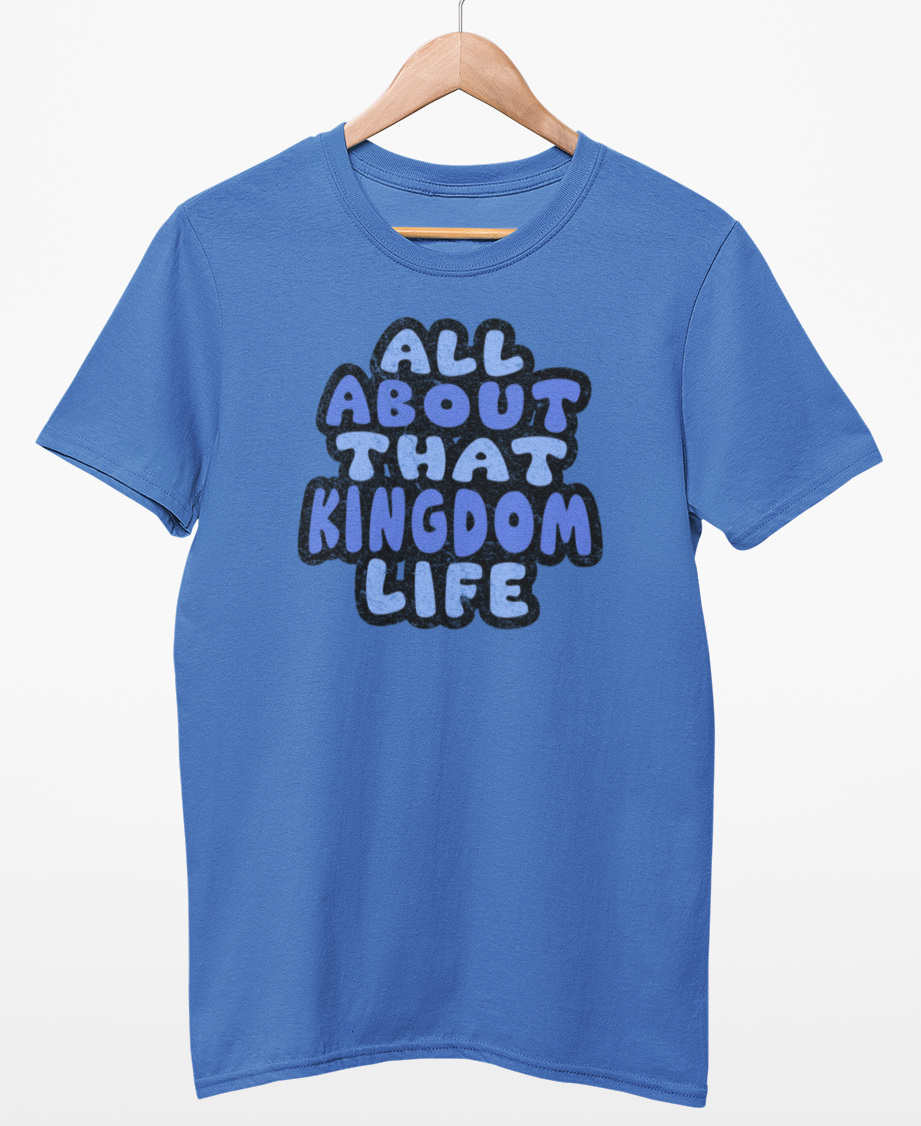 Iris blue t-shirt with 'All About That Kingdom Life' distressed text on a hanger against a white background