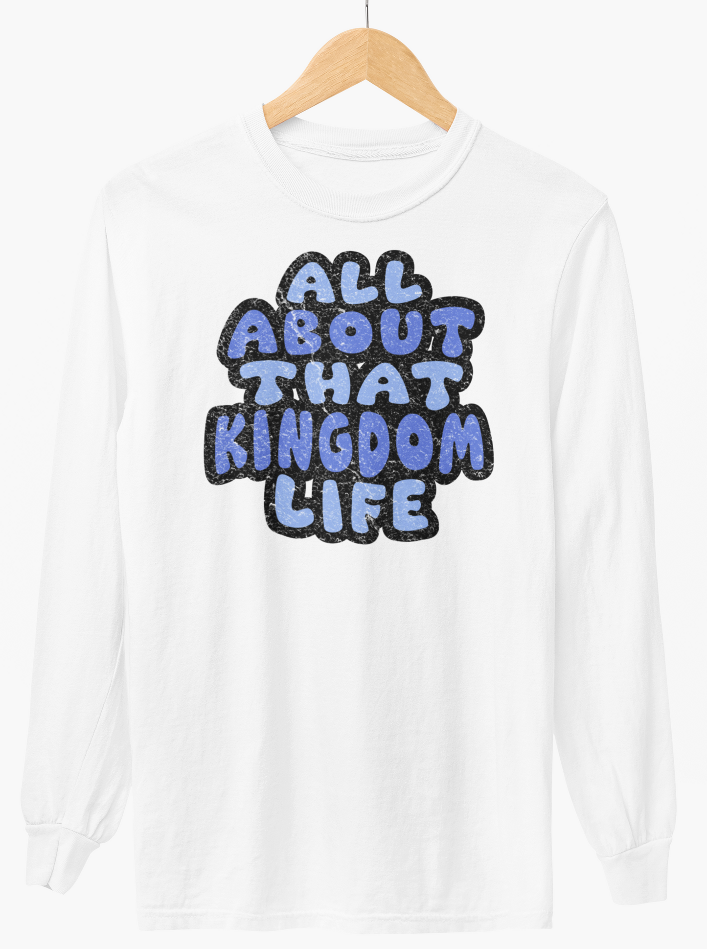 White long-sleeve shirt with 'All About That Kingdom Life' distressed text on a hanger against a white background